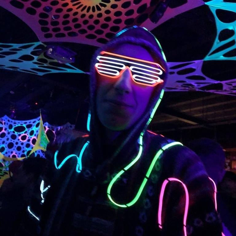 Anders wearing poncho and glasses with electroluminescent wire at Rebellion, Manchester for Crystal Kids - Psychedelic Journey 2